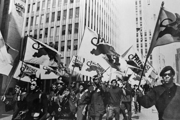 Black Panthers march to a news conference in New York to protest at the trial of one of their members, Huey P Newton.