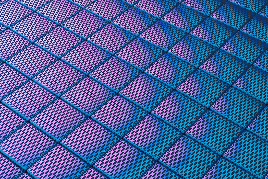 Vivid gradient lighting on perforated metal tiles creates a geometric pattern.