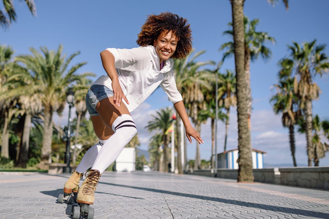 A woman roller skating outside