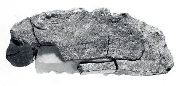 A Mesopotamian flint sickle blade attached to a handle by bitumen, ~2800 BCE