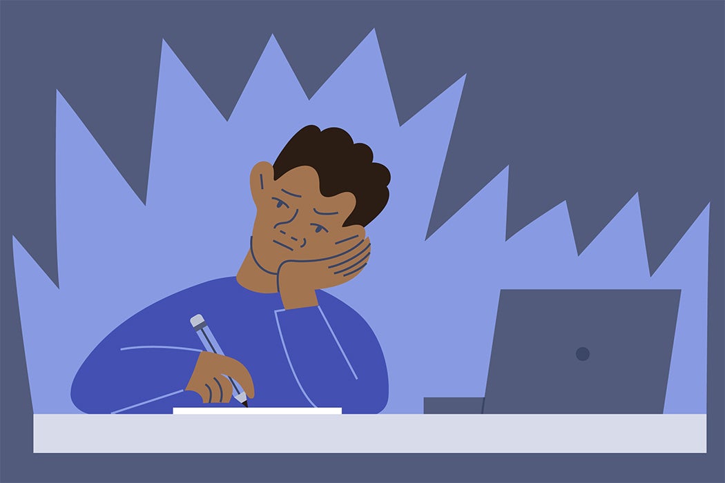 A young man struggles with homework and studying for exams