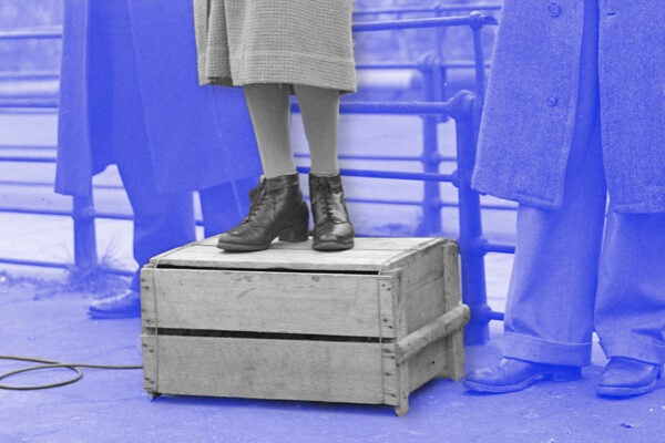 Illustration from a woman standing on a soapbox speaking into a microphone, 1944